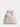 Beige drawstring bag with 'SACHAJUAN' branding on a light gray background